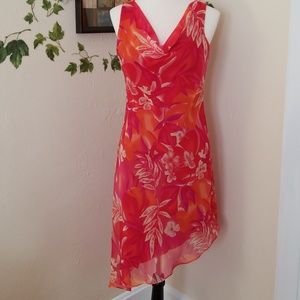 Red sleeveless asymmetrical hem dress.